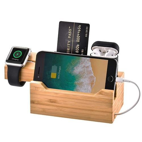 Trexonic bamboo charging station holding Apple Watch, iPhone, AirPods, and a card for a stylish, clutter-free setup.
